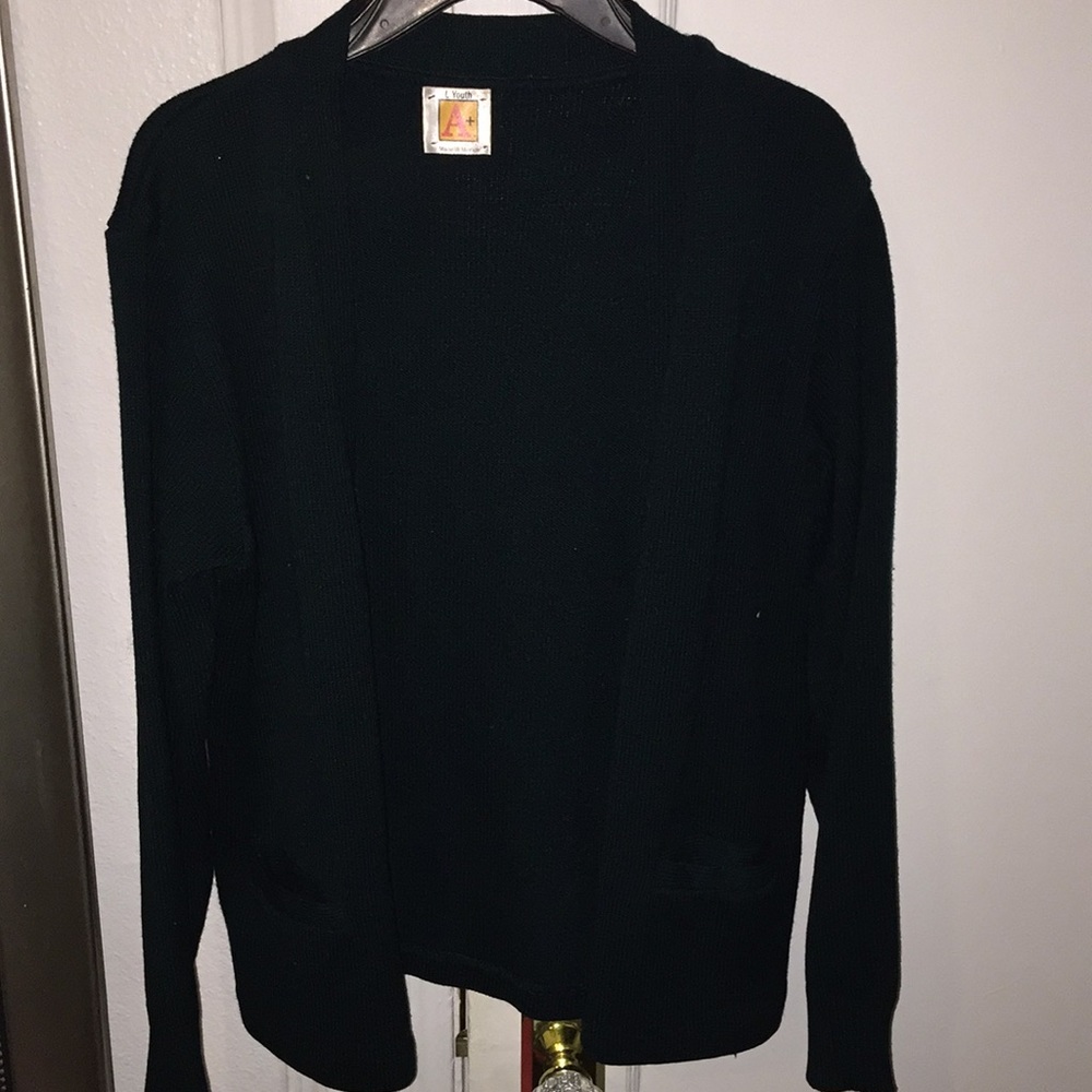 A dark green cardigan